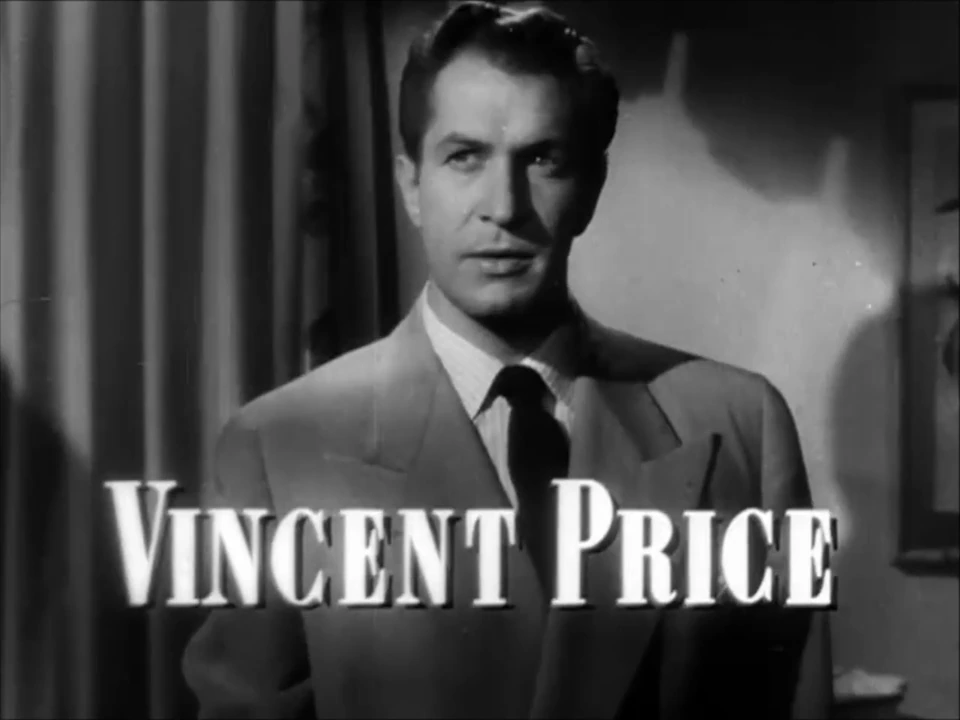 Vincent Price in a black-and-white film still, wearing a suit and looking off to the side.